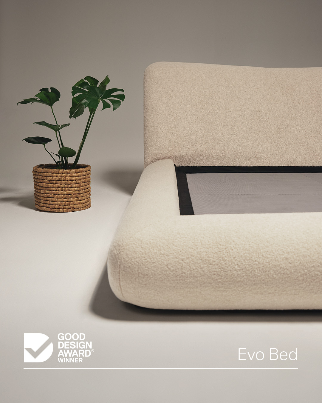 The award-winning retro bed in a light neutral bouclé fabric.