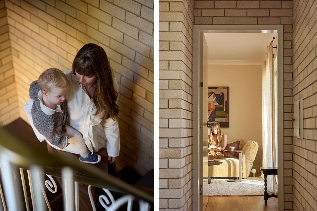 A mother and toddler on an apartment staircase, with a view through to the Sydney living room.